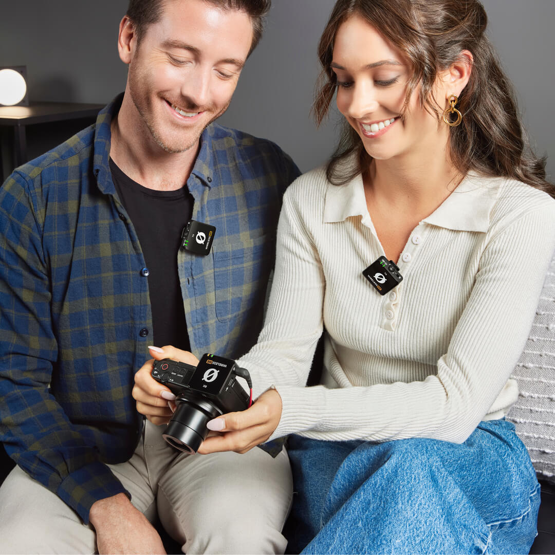 Couple using Wireless ME Dual reviewing camera footage
